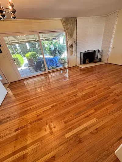 Refinished oak floor in a sunny living room