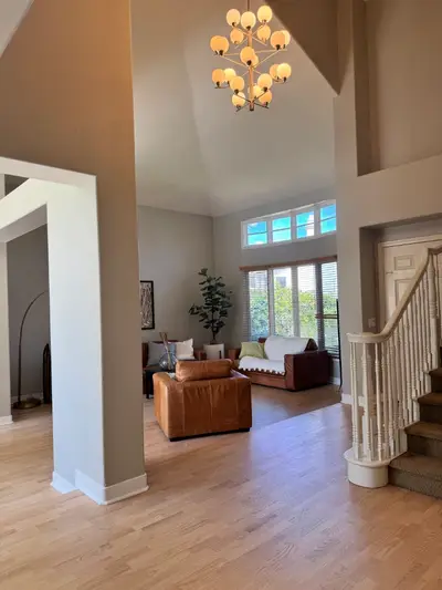 Light natural hardwood in a vaulted living room