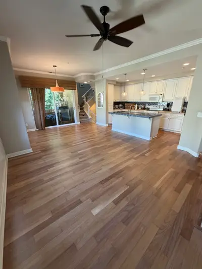 Open-plan living room with refinished hardwood