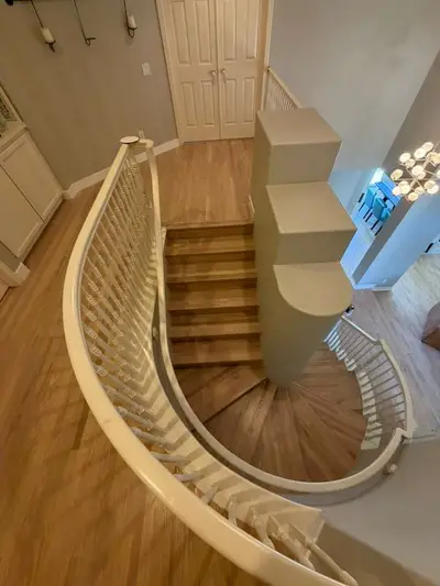 Curved staircase and refinished landing