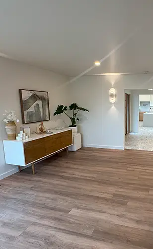 Newly installed wide-plank floor in a bright modern living room